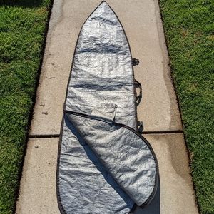 Surfboard Case with Velcro pocket for wax or other things. One handle and 2 clip